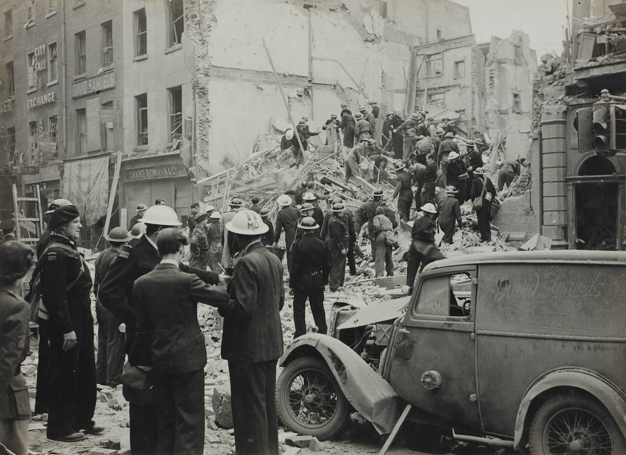 Rescue workers clearing rubble from a collapsed building