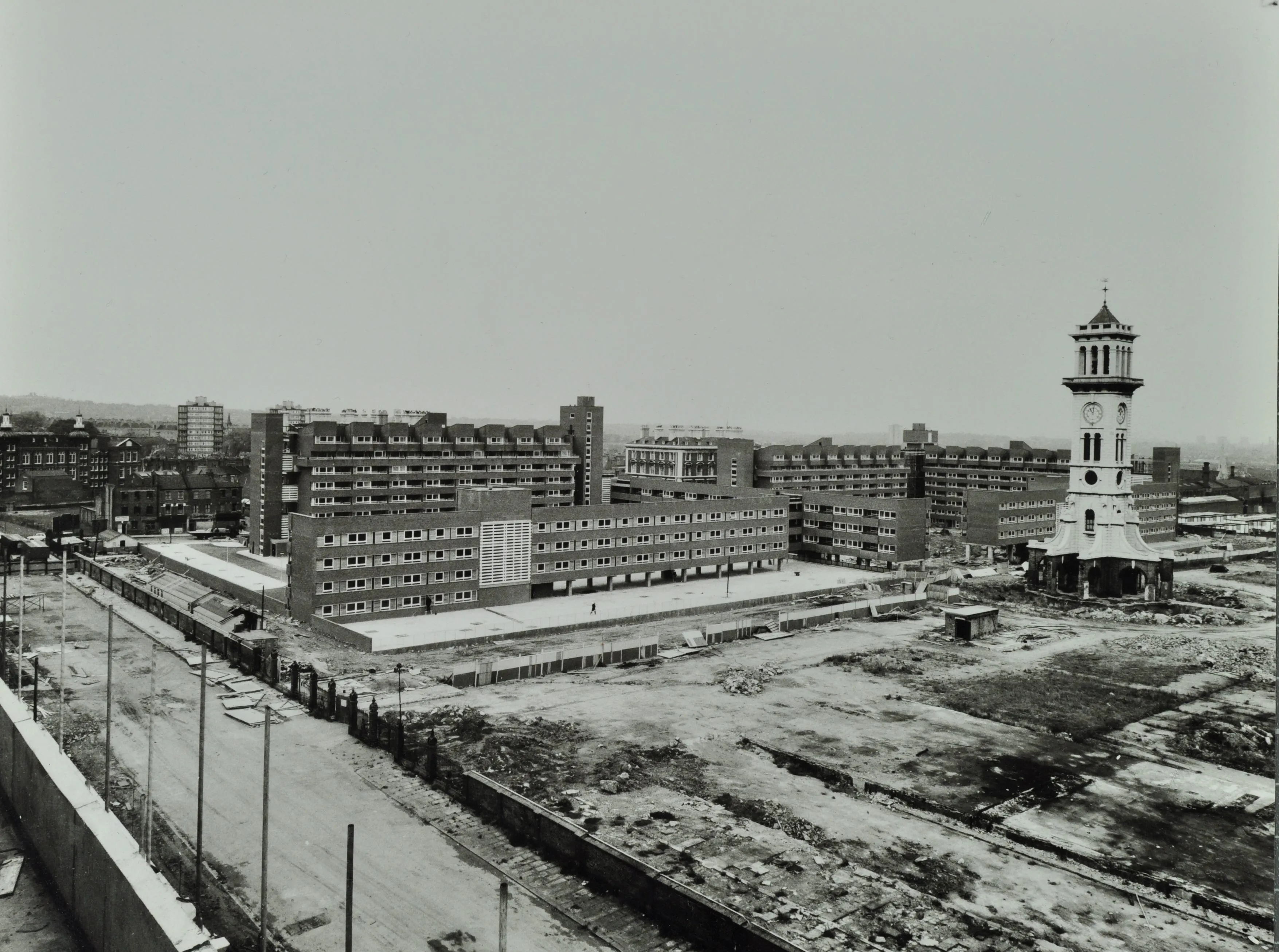 construction of new flats beside a waste ground and a clock tower
