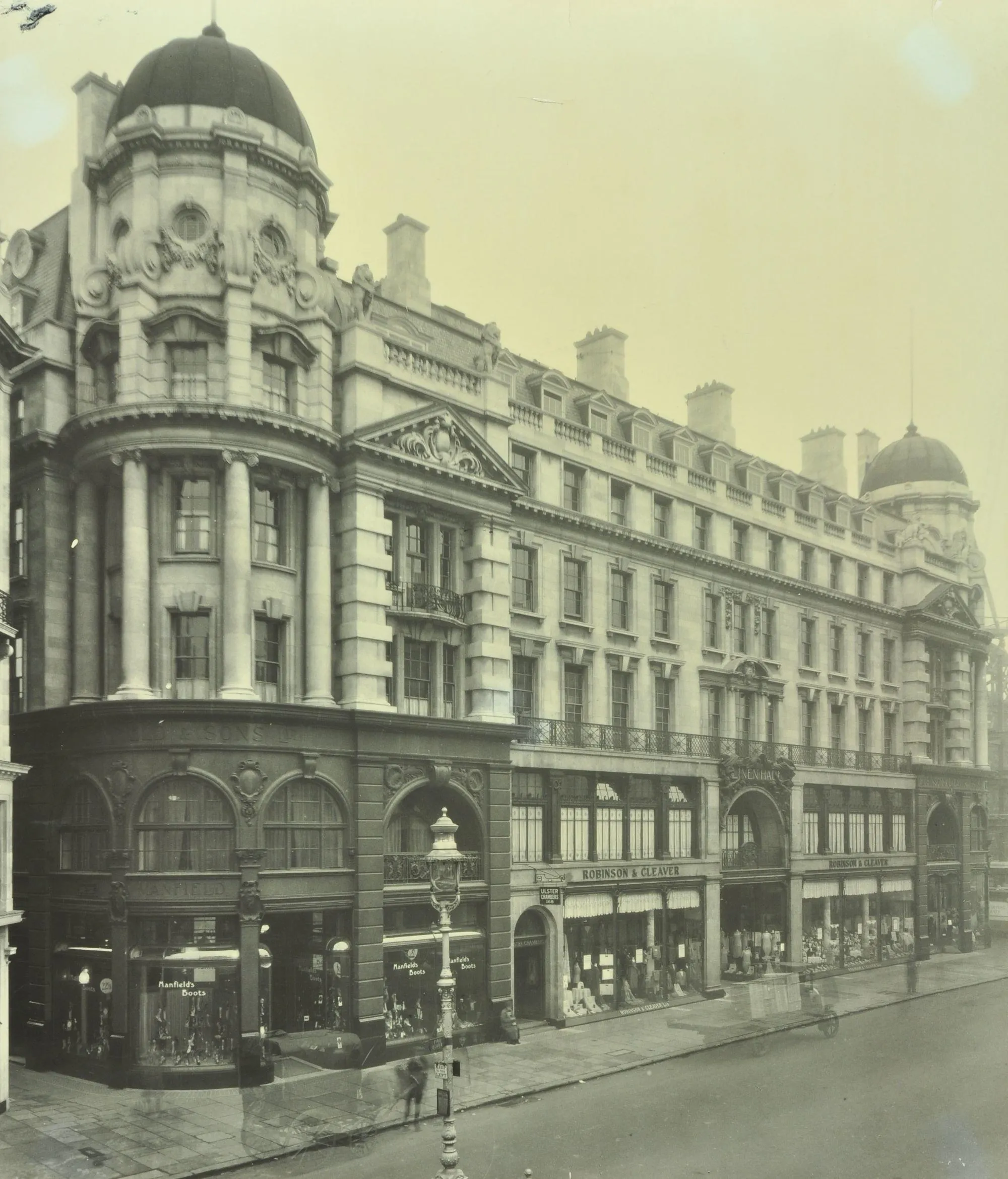 Shop buildings in Regent Street on a corner with a lamp post in the foreground
