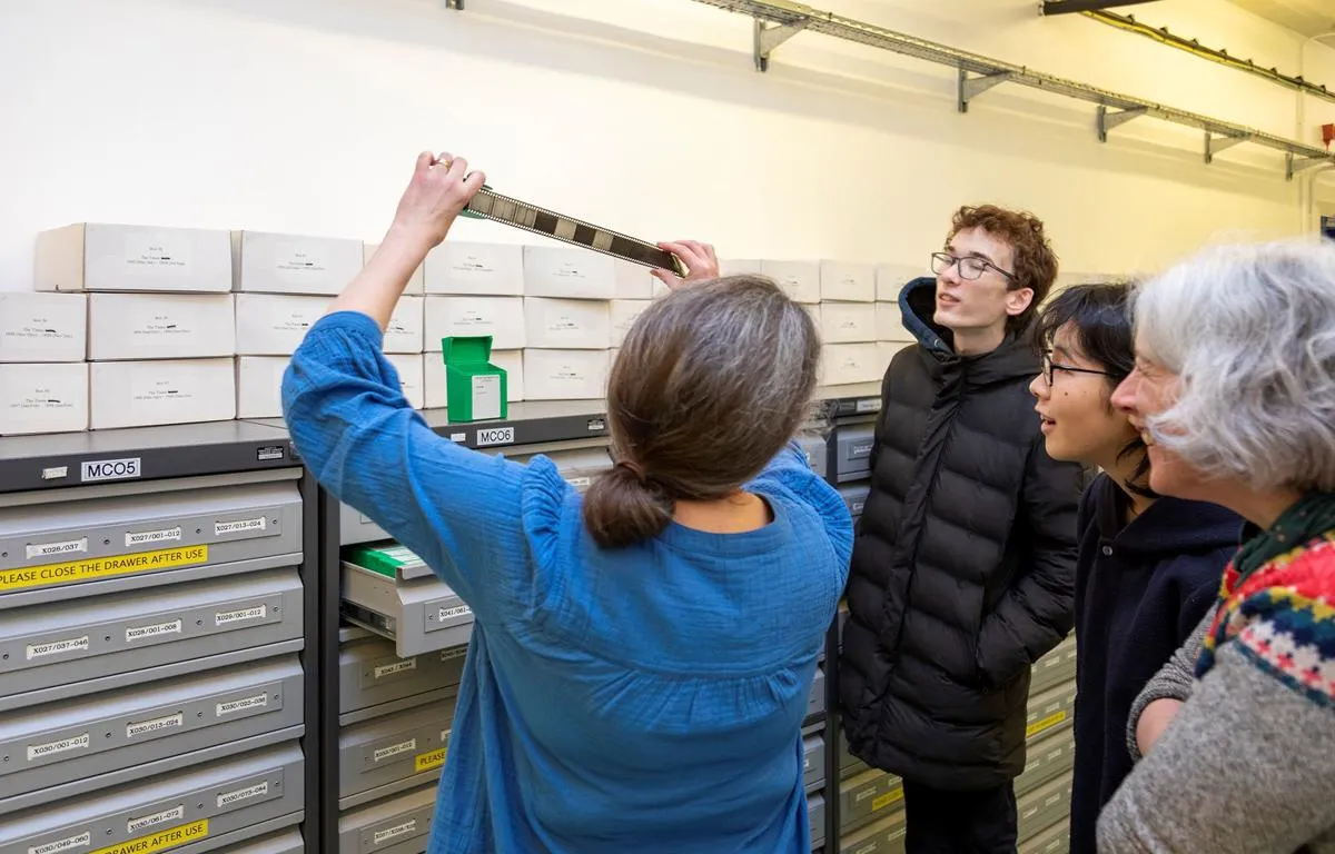 staff-showing-film-roll-at-huntley-conference