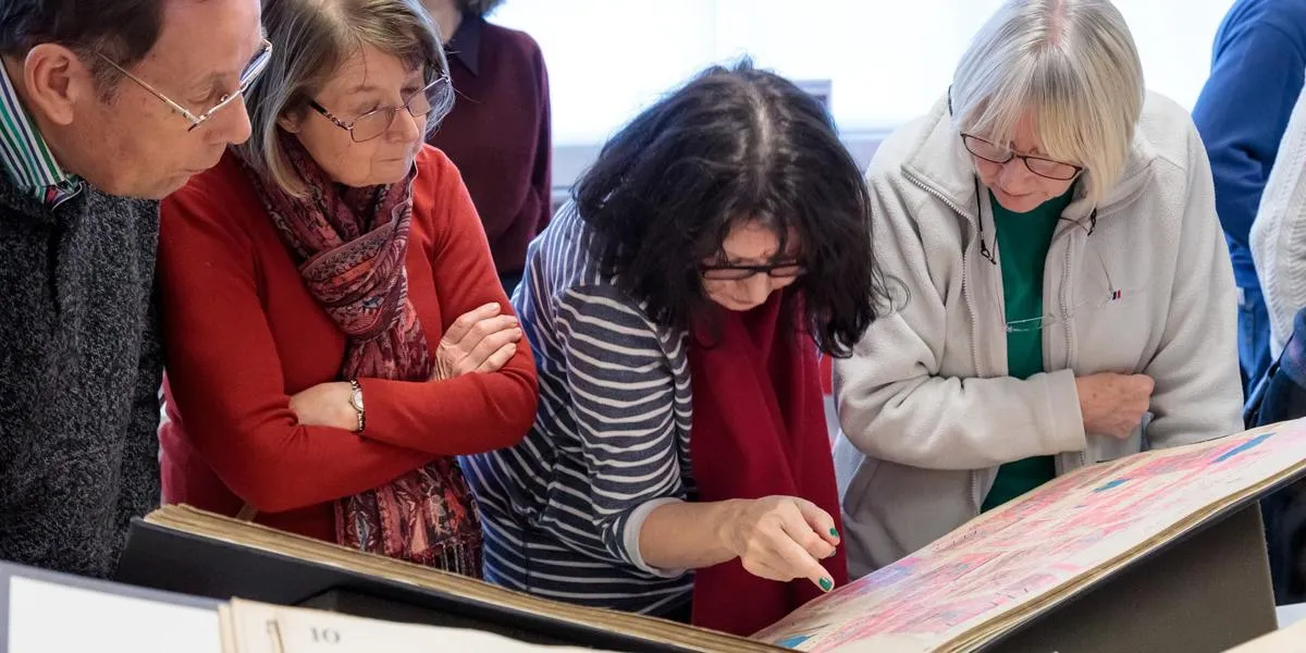 visitors-looking-at-an-archive-document