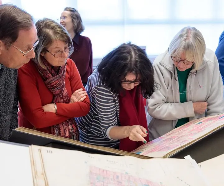 visitors-looking-at-an-archive-document