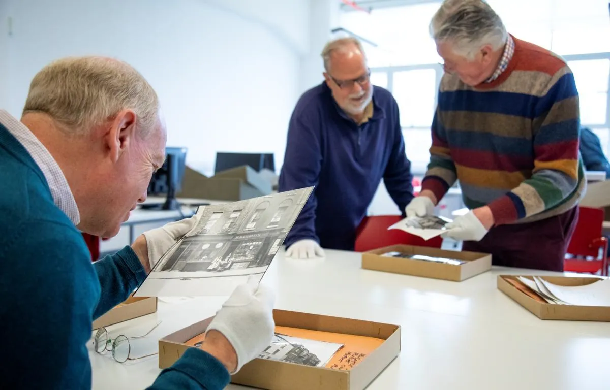volunteers-viewing-photo-boxes